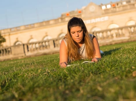 Lucky girl relaxing in the gardens next to the Invalides and the Alexander the 3rd bridge in Paris