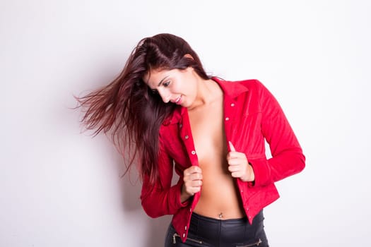 Sexy woman posing in studio against white background