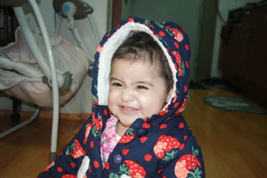 Portrait of a baby girl with smiling face, big eyes and lovely face gesture