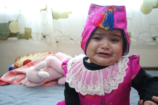 Portrait of a baby girl with smiling face, big eyes and lovely face gesture