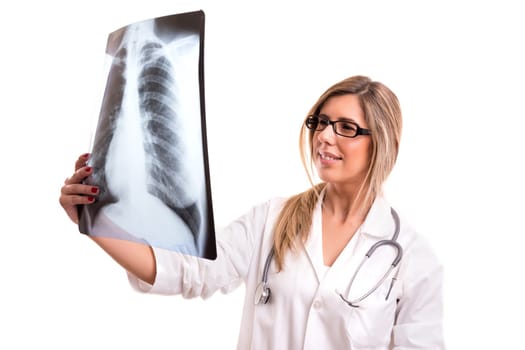 Beautiful young doctor looking at some exams, isolated over white