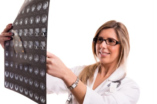 Beautiful young doctor looking at some exams, isolated over white