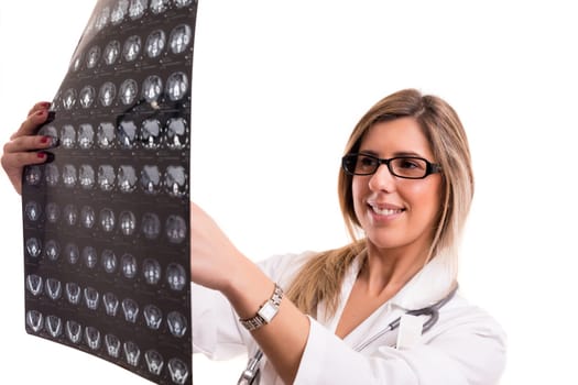 Beautiful young doctor looking at some exams, isolated over white