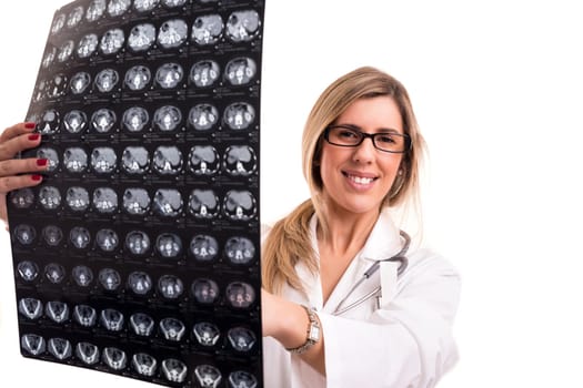Beautiful young doctor looking at some exams, isolated over white