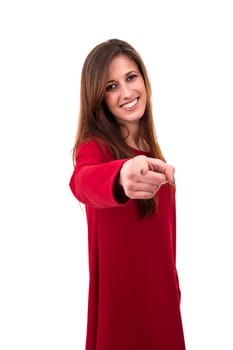 Young beautiful woman pointing at you, isolated over white