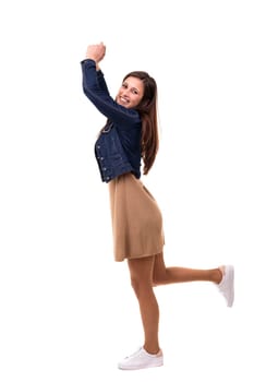 Studio shot: Happy woman with raised arms