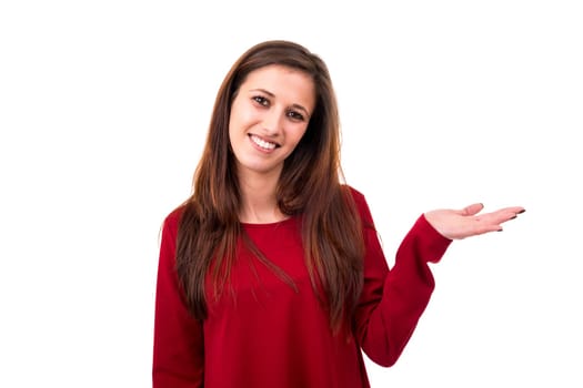 Young beautiful woman presenting your product, isolated over white background