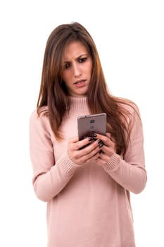 Young beautiful woman at the phone, isolated over a white background