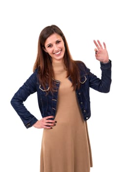 Beautiful young woman signaling ok, isolated over white