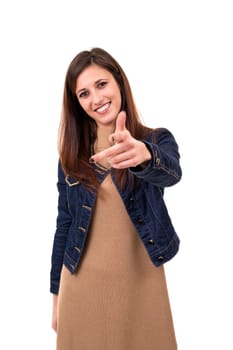Young beautiful woman pointing at you, isolated over white