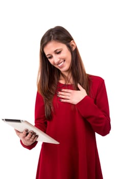 Beautiful woman relaxing with a tablet computer