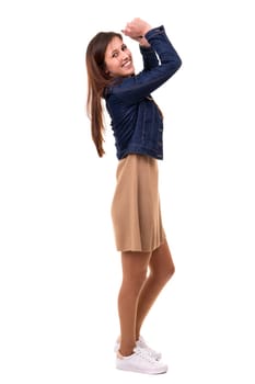 Studio shot: Happy woman with raised arms