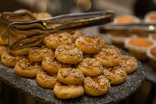 Buffet table with various cookies and biscuits, tarts and cakes.
