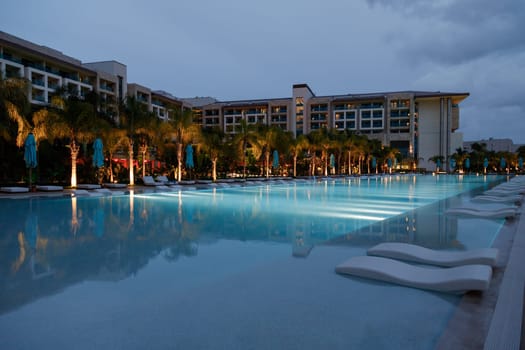 ANTALYA, TURKEY - December 11, 2020: Exterior, building and swimming pool of Regnum Carya Golf and SPA resort