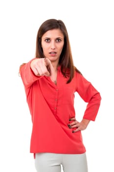 Young beautiful woman pointing at you, isolated over white