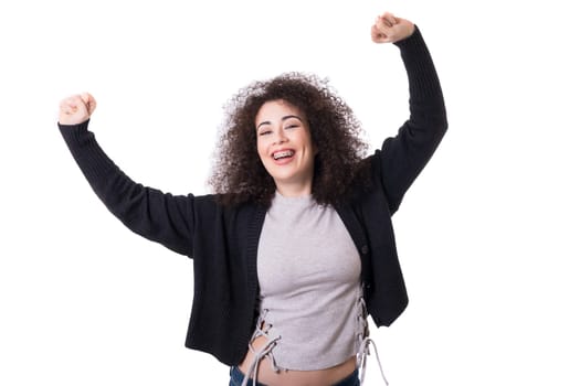 Very happy woman raising her arms and celebrating