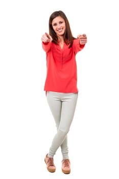 Young beautiful woman pointing at you, isolated over white