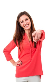 Young beautiful woman pointing at you, isolated over white