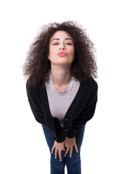Beautiful young woman blowing you a kiss, isolated over white