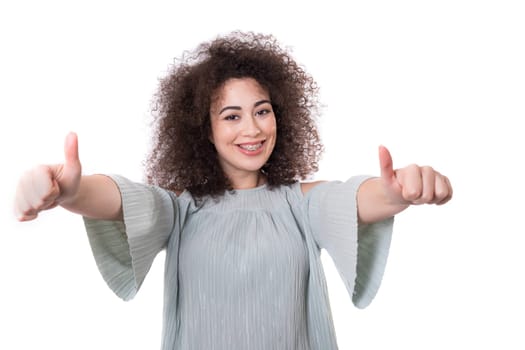 Beautiful young woman signaling ok, isolated over white