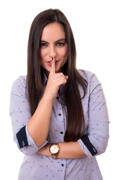 Beautiful young woman asking for silence isolated