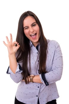 Beautiful young woman signaling ok, isolated over white