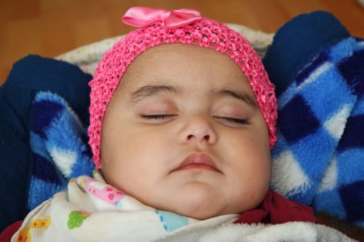 Portrait of a baby girl with smiling face, big eyes and lovely face gesture