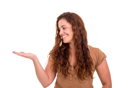 Young beautiful woman presenting your product, isolated over white background