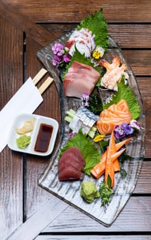 Variety of gourmet Sashimi set japanese freshness cuisine Salmon Tuna Otoro Saba Hamachi Octopus and shrimp meat. Restaurant gastronomy food and drink consumerism concept.
