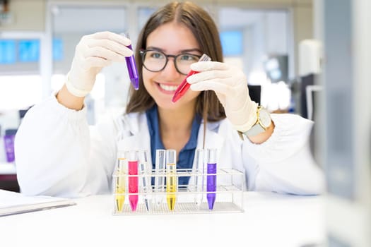 Beautiful young scientist working at the laboratory