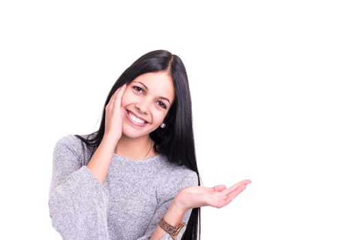Young beautiful woman presenting your product, isolated over white background