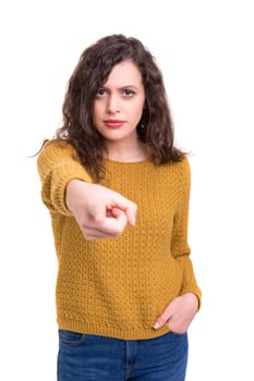 Young beautiful woman pointing at you, isolated over white