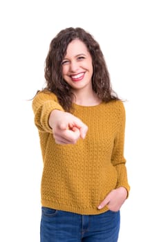Young beautiful woman pointing at you, isolated over white