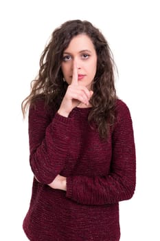 Beautiful young woman asking for silence isolated