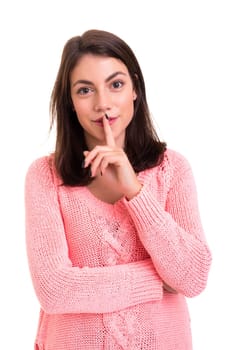 Beautiful young woman asking for silence isolated