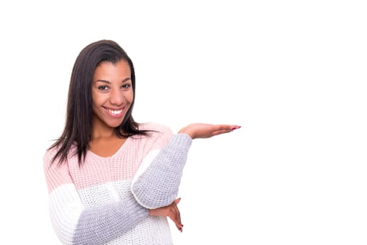 Young beautiful african woman presenting your product, isolated over white background