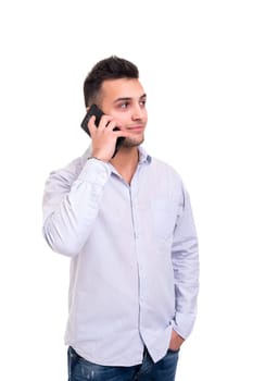 Young man at the phone, isolated over white background