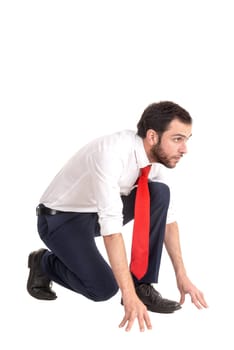 Businessman ready to run isolated against a white background