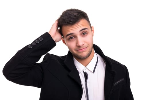 Studio picture of a young and handsome man posing isolated