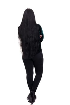 Woman posing with her back faced to camera, isolated over copy space background