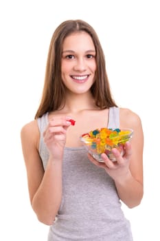 Young woman holding a bowl of jelly gummy bears, isolated over white background