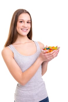 Young woman holding a bowl of jelly gummy bears, isolated over white background