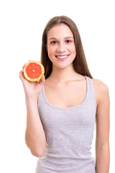 Young woman holding a fresh grapefruit, isolated over white background