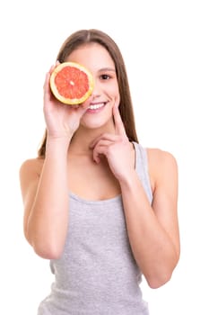 Young woman holding a fresh grapefruit, isolated over white background