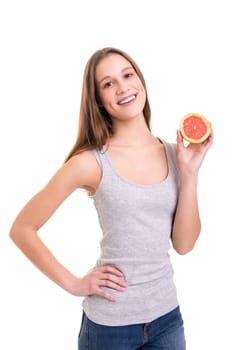 Young woman holding a fresh grapefruit, isolated over white background