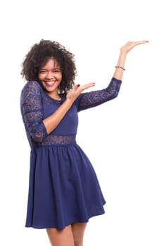 Young beautiful african woman presenting your product, isolated over white background