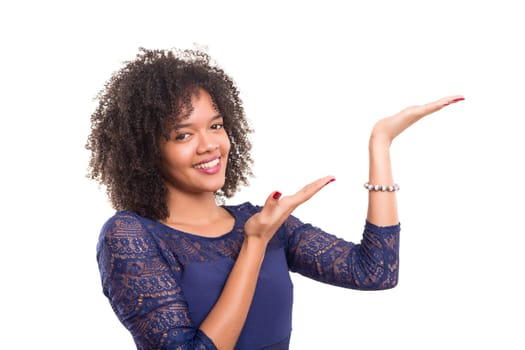 Young beautiful african woman presenting your product, isolated over white background