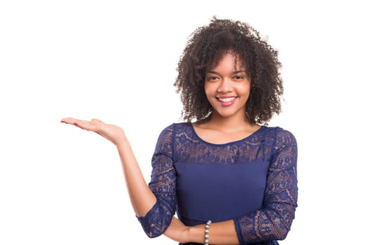 Young beautiful african woman presenting your product, isolated over white background