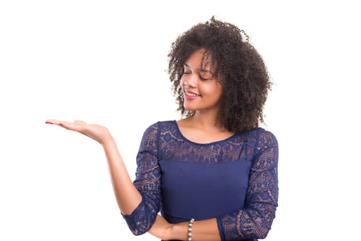 Young beautiful african woman presenting your product, isolated over white background