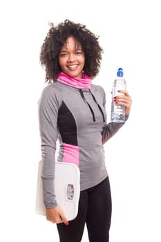 Studio shot of a beautiful african woman exercising